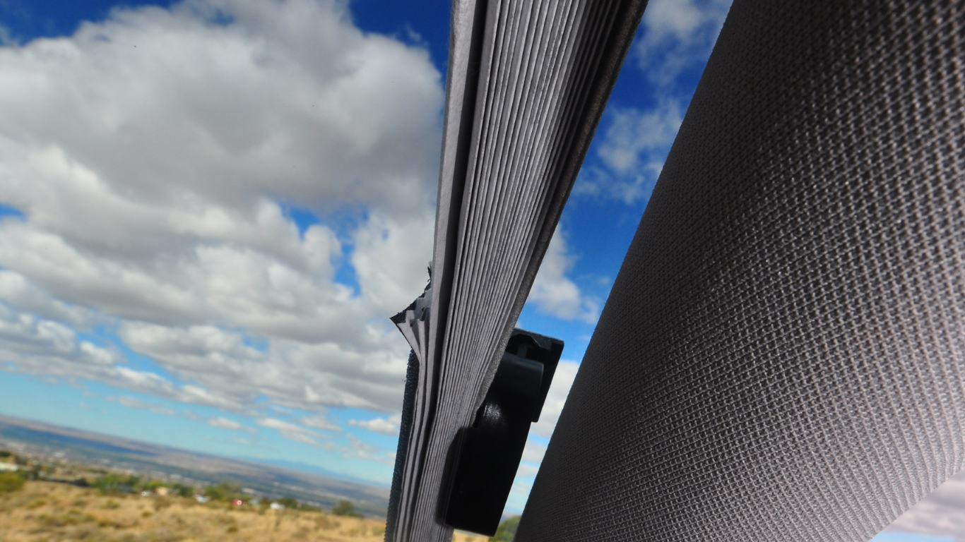 cargo truck side window covered in protective truck sun shade